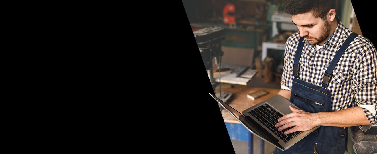 Hero image of someone in a shop looking at an online catalog