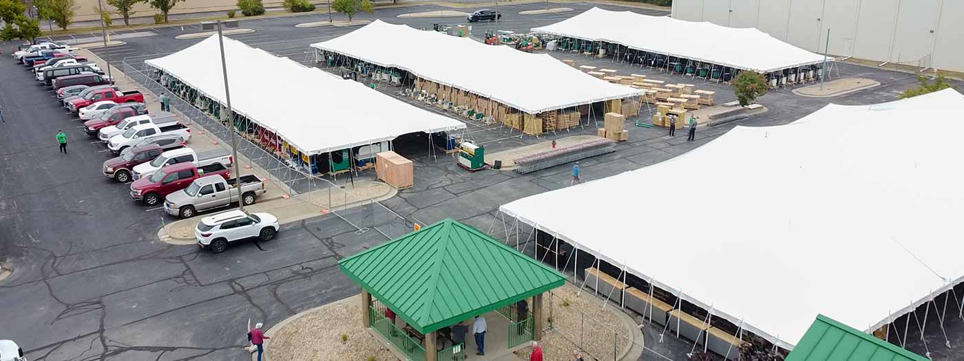 A photo of a Grizzly tent sale setup from a distance