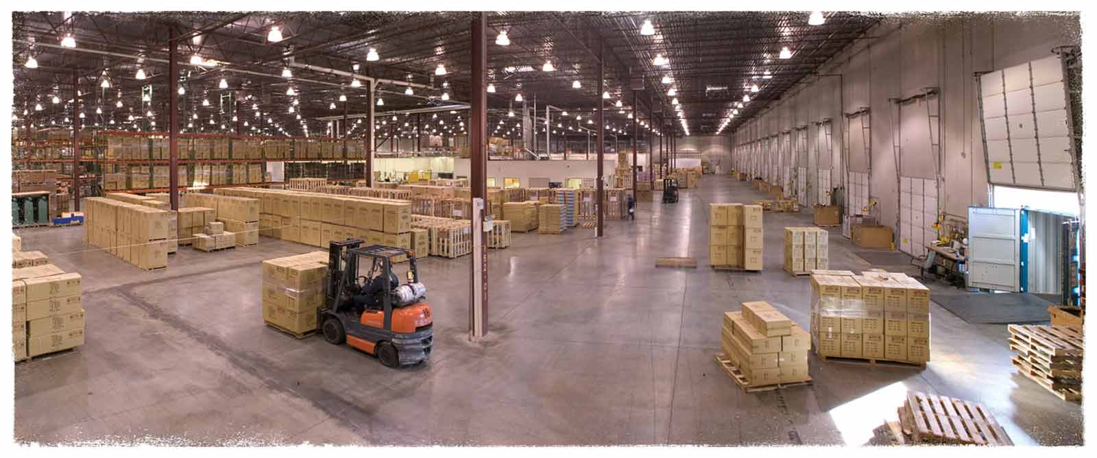 A worker on a forklift transports a full pallet across the huge Grizzly warehouse in Springfield, MO